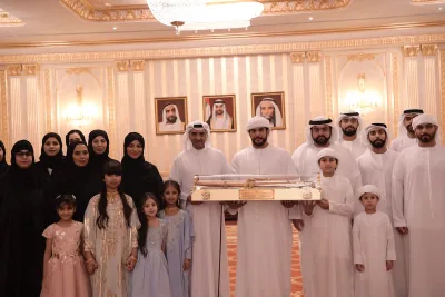 Group photo at a ceremony hall with families and children